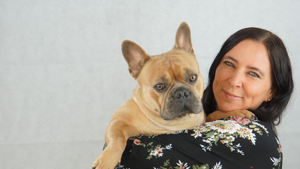 woman holding french bulldog